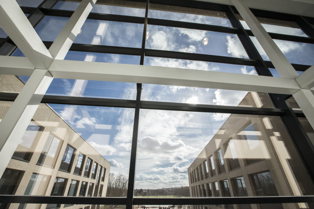 A shot of the large windows in front of a patio area on the Leigh Academy Strood premises.