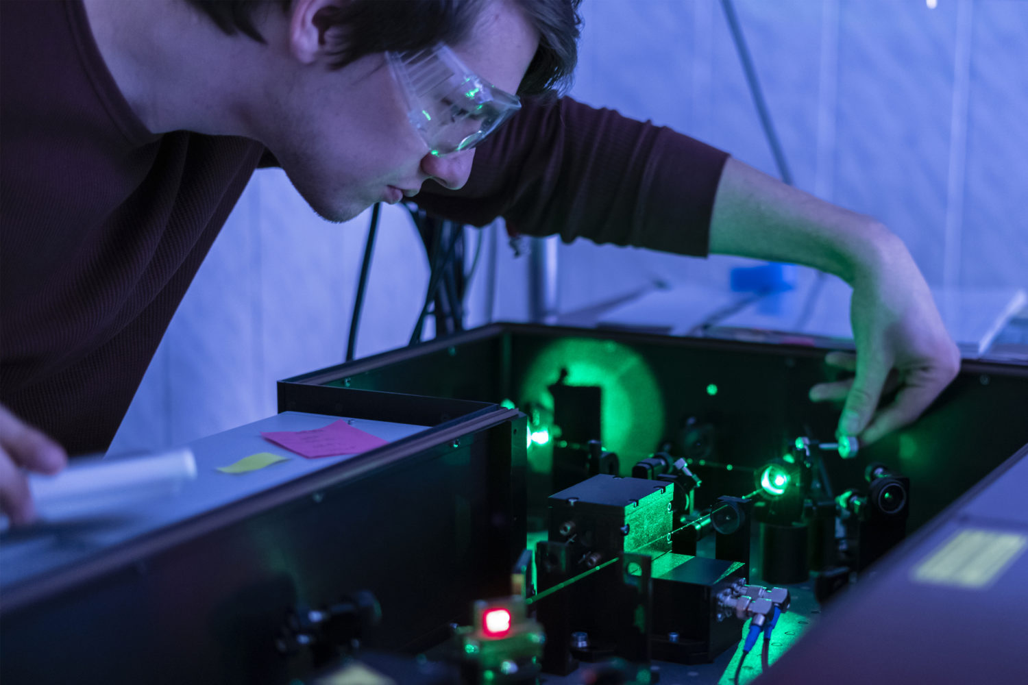 Scientist work with laser machine or system