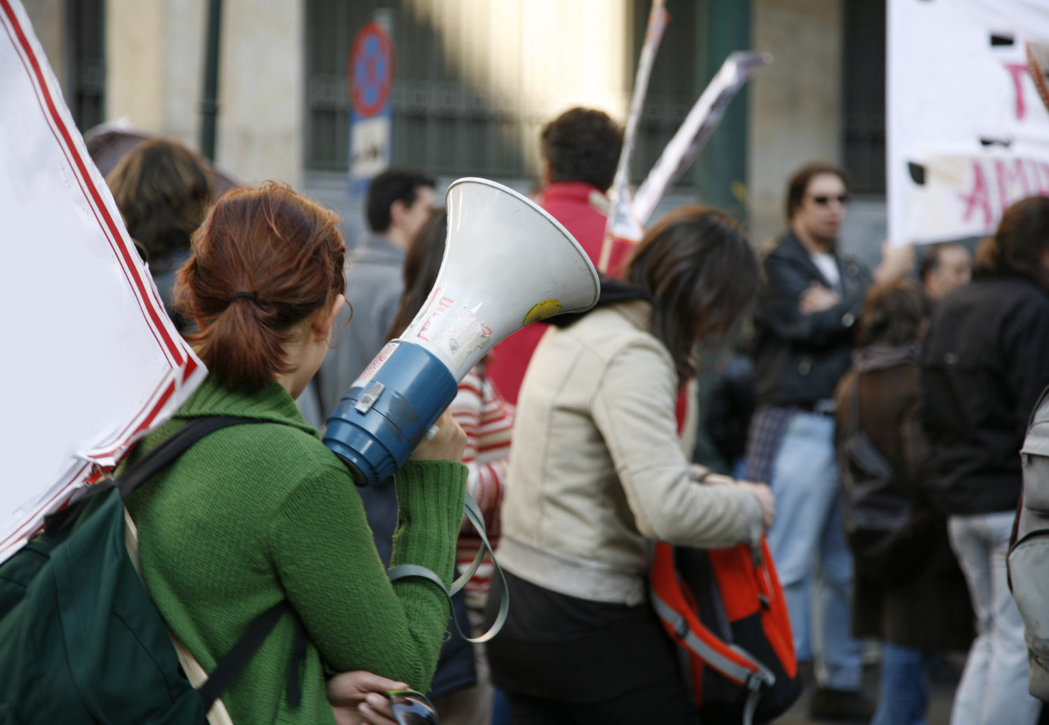 University students waving banners during an educational march in Athens, Greece.