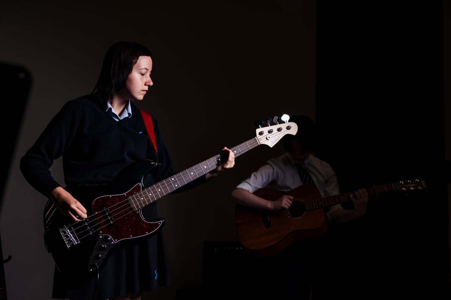 Student playing guitar